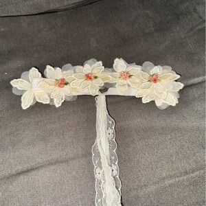 No label. Infant Flower Girl head band.
